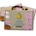 Box of Taiwan Chicken Consomème with cherry blossom design on a gray background