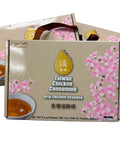 Box of Taiwan Chicken Consomème with cherry blossom design on a gray background